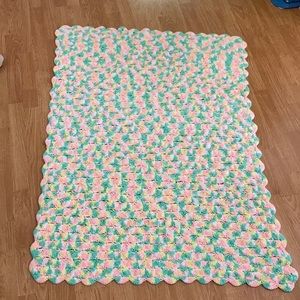 Pink green white and yellow hand knit baby blanket